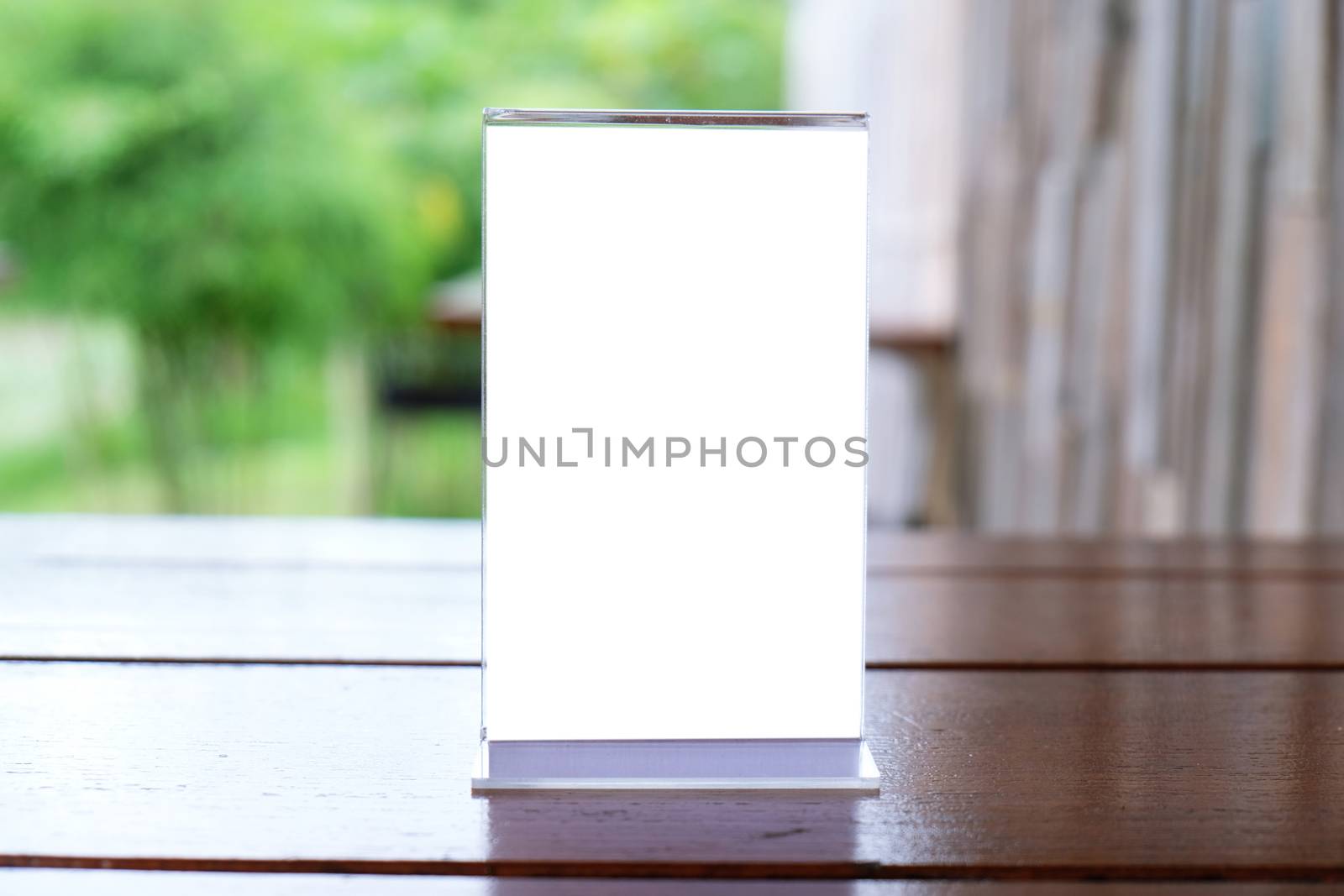 Menu frame standing on wood table in Bar restaurant cafe. space  by peandben