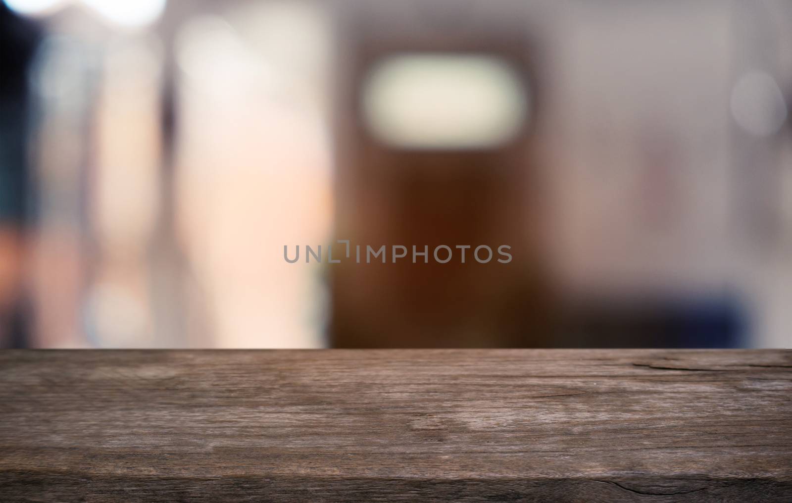 Empty dark wooden table in front of abstract blurred bokeh backg by peandben