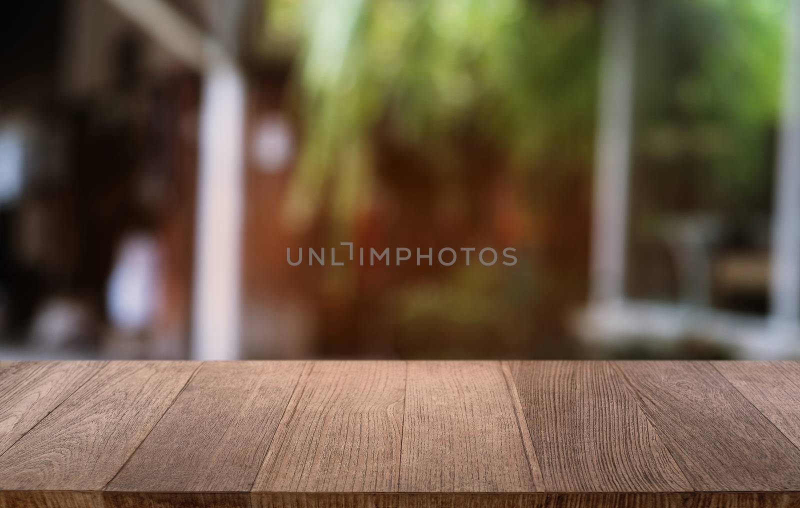 Empty dark wooden table in front of abstract blurred bokeh backg by peandben