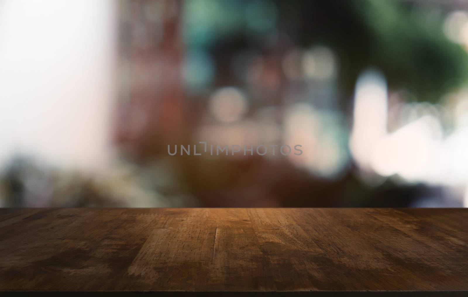 Empty dark wooden table in front of abstract blurred bokeh background of restaurant . can be used for display or montage your products.Mock up for space