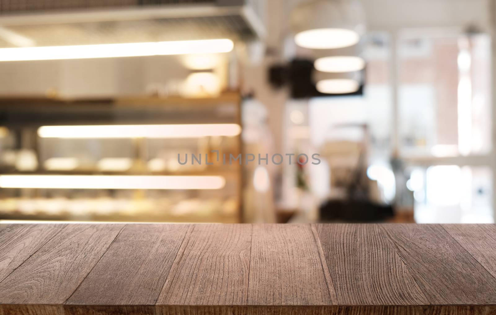 Empty dark wooden table in front of abstract blurred bokeh backg by peandben