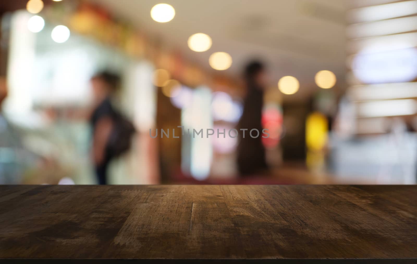 Empty wood table top and blur of night market background/selecti by peandben