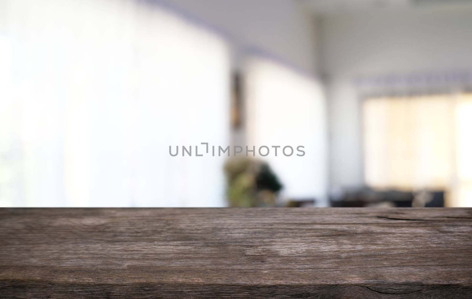 Empty dark wooden table in front of abstract blurred bokeh backg by peandben