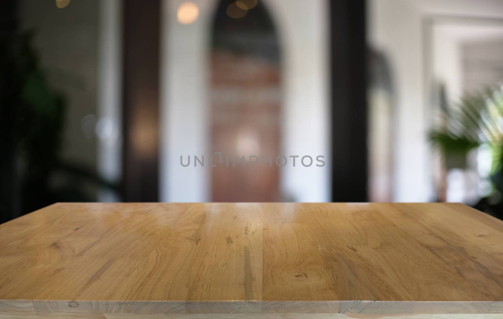 Empty dark wooden table in front of abstract blurred bokeh backg by peandben