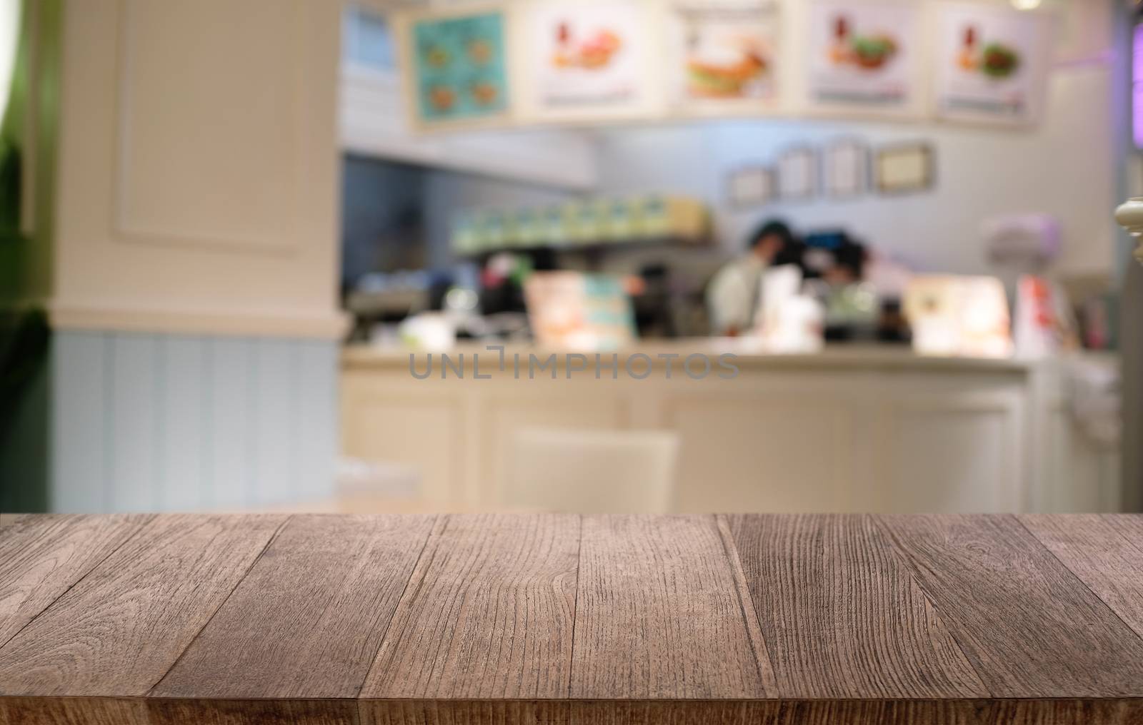 Empty dark wooden table in front of abstract blurred bokeh backg by peandben