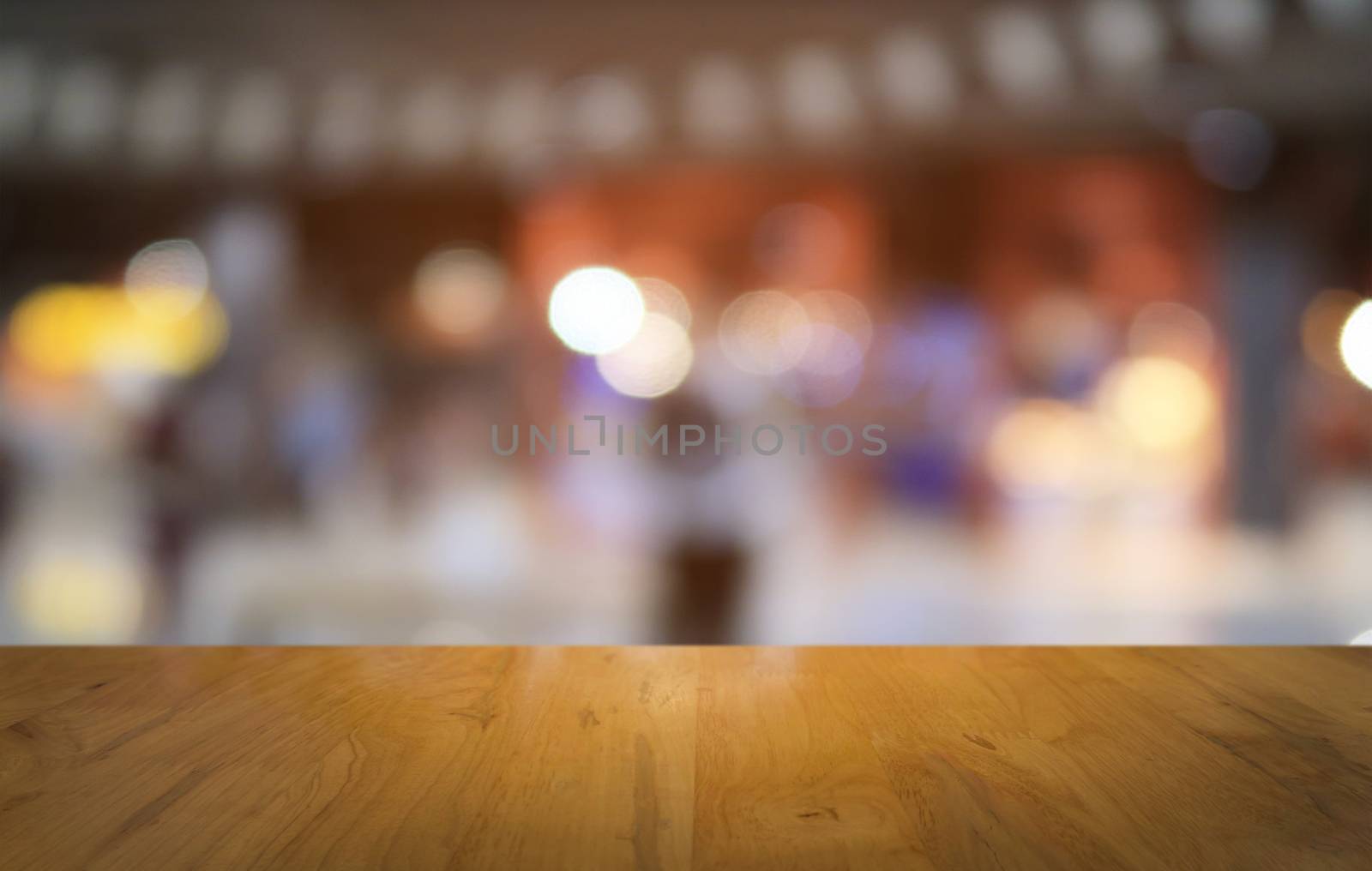 Empty dark wooden table in front of abstract blurred bokeh backg by peandben