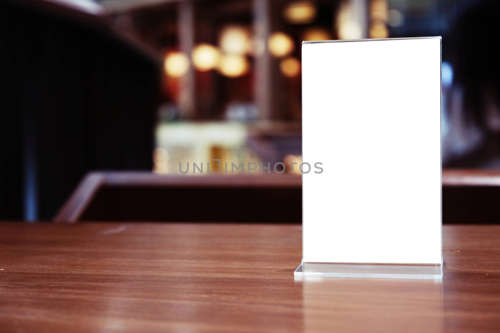 Menu frame standing on wood table in Bar restaurant cafe. space for text marketing promotion