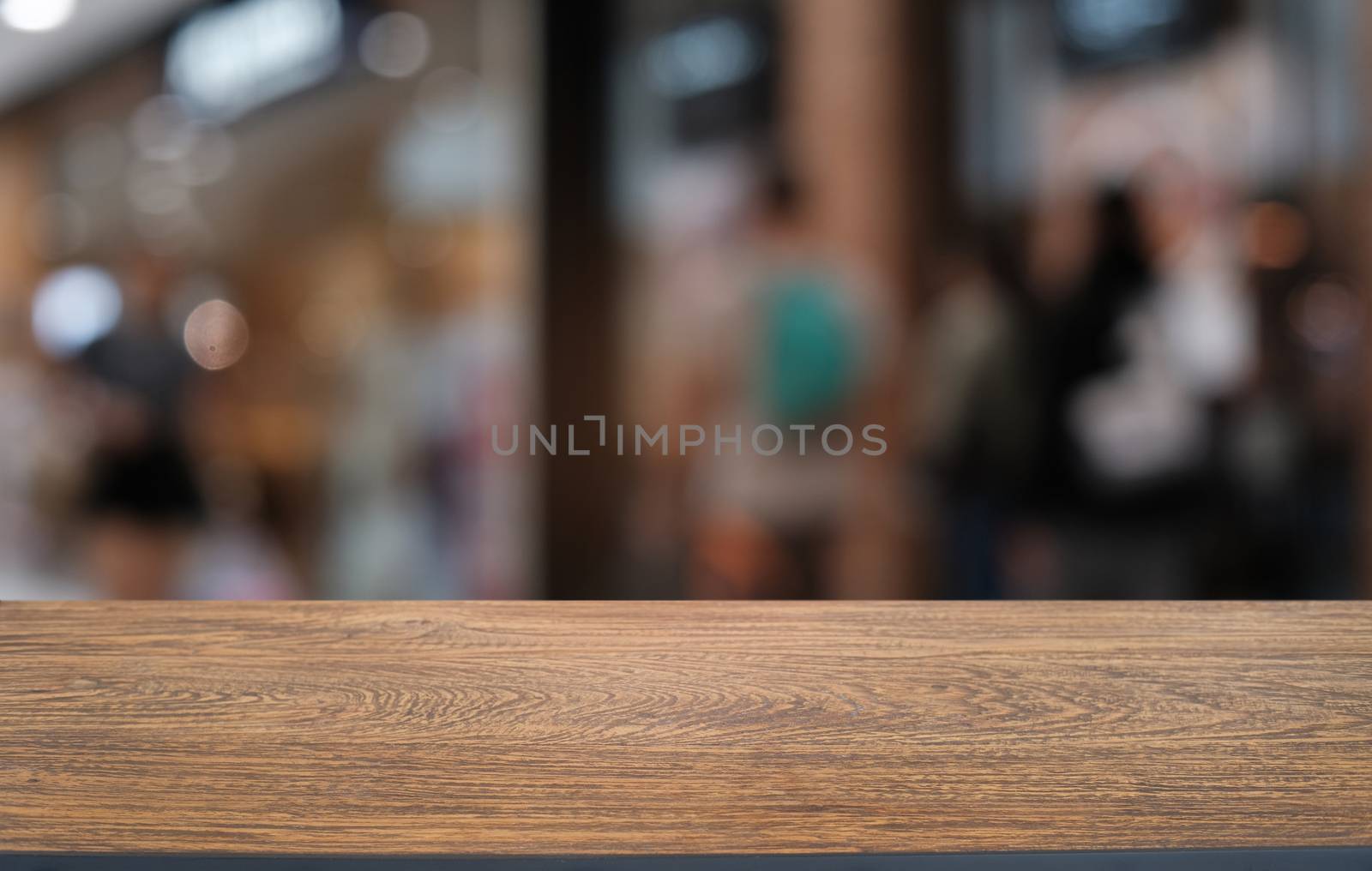 Empty dark wooden table in front of abstract blurred bokeh backg by peandben