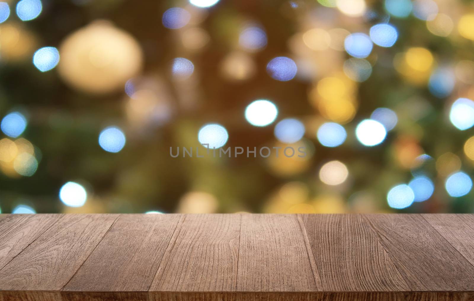 Empty dark wooden table in front of abstract blurred bokeh backg by peandben