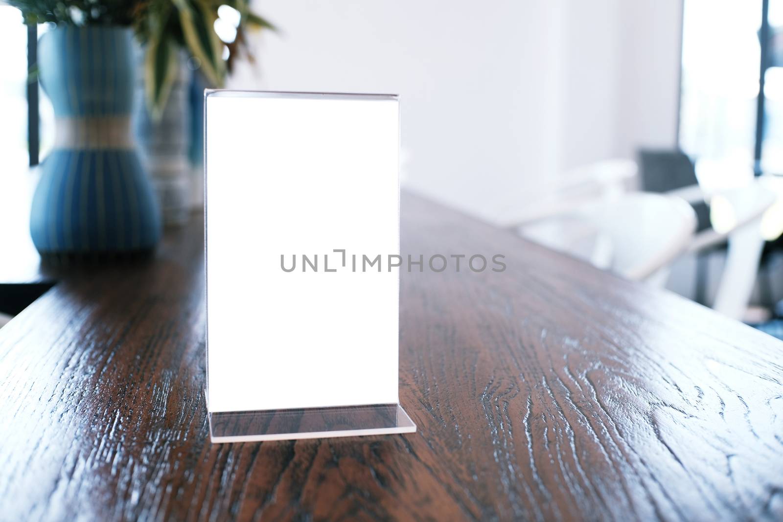 Menu frame standing on wood table in Bar restaurant cafe. space  by peandben