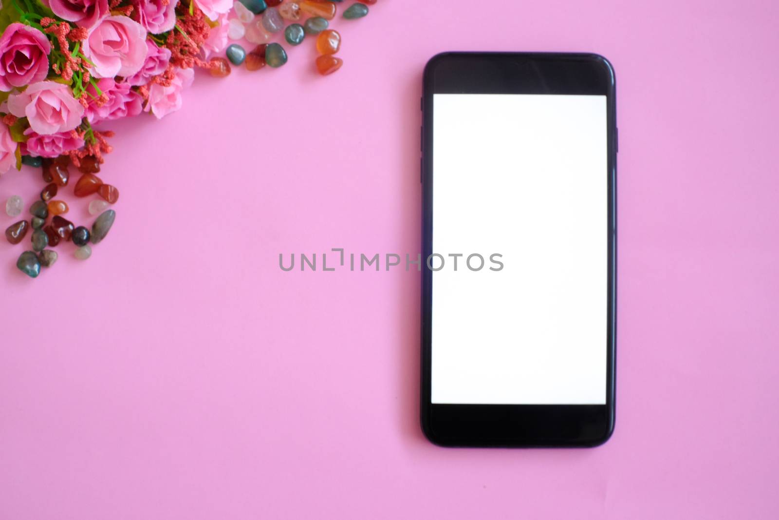 Mockup of smart phone on office desk. by peandben