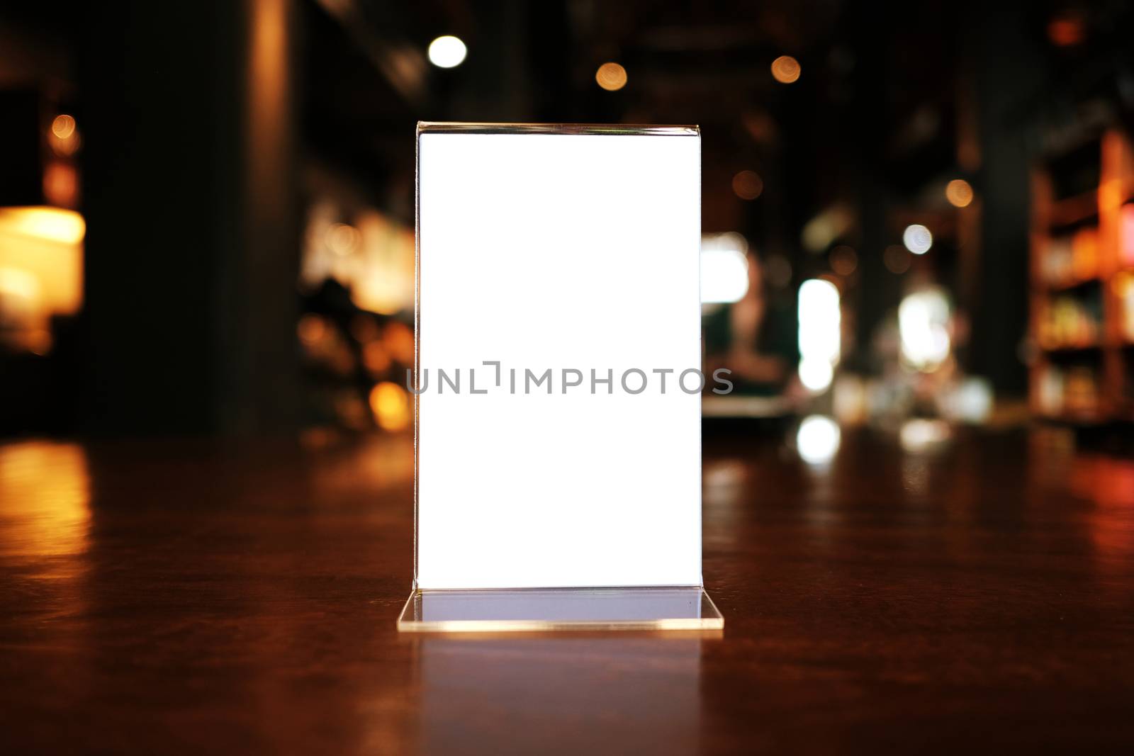 Menu frame standing on wood table in Bar restaurant cafe. space for text marketing promotion