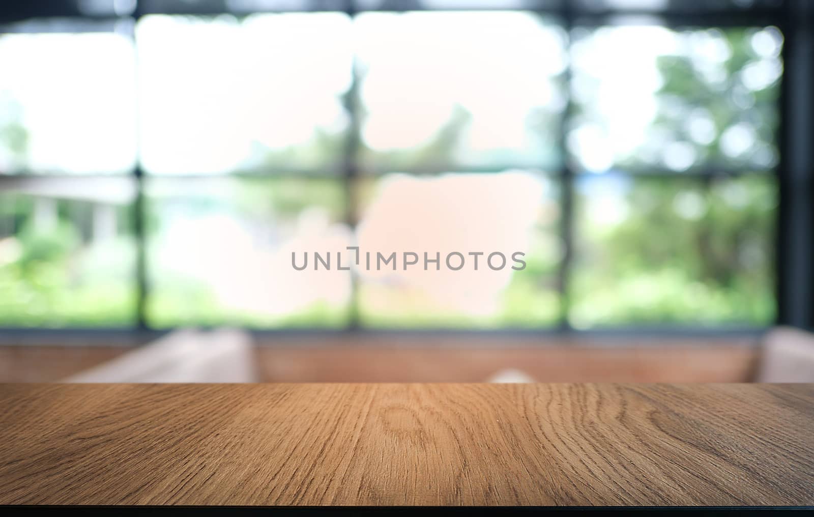 Empty dark wooden table in front of abstract blurred bokeh backg by peandben