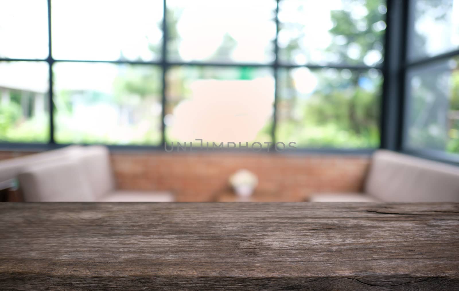 Empty dark wooden table in front of abstract blurred bokeh backg by peandben