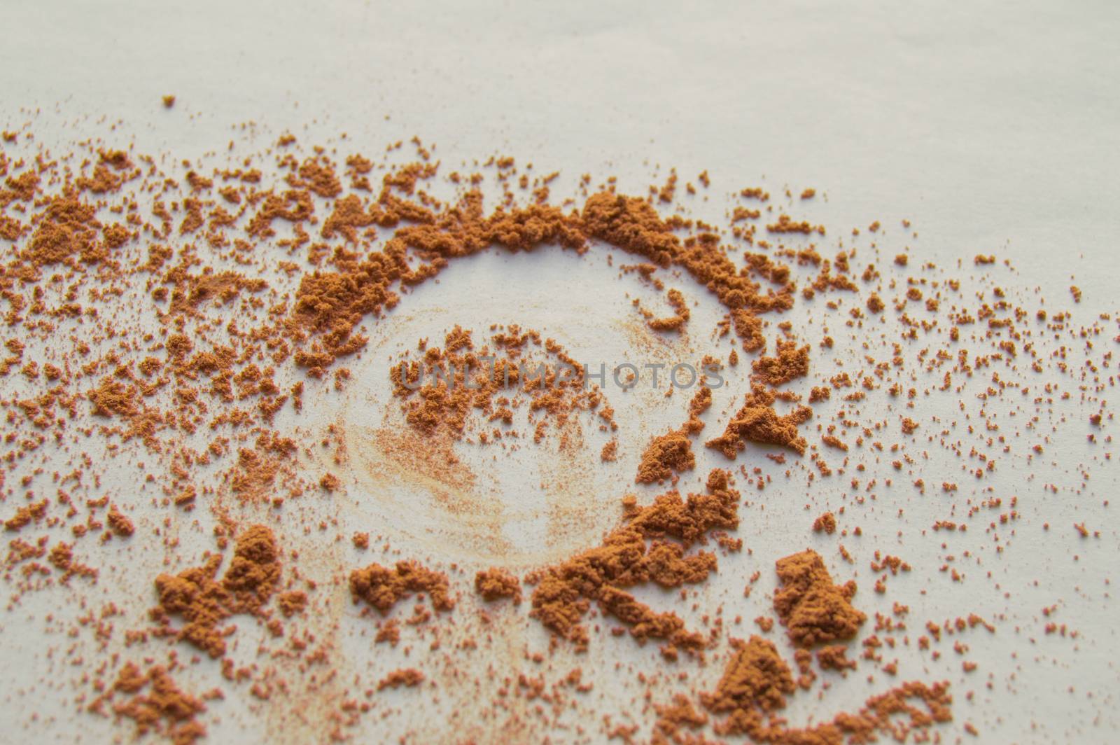 Scattered beige powder, Crumbles natural makeup powder on white background by claire_lucia