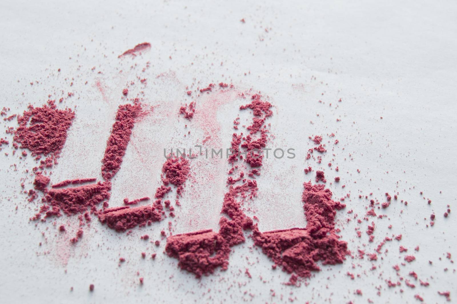 Pink blush scattered on white background, makeup background by claire_lucia