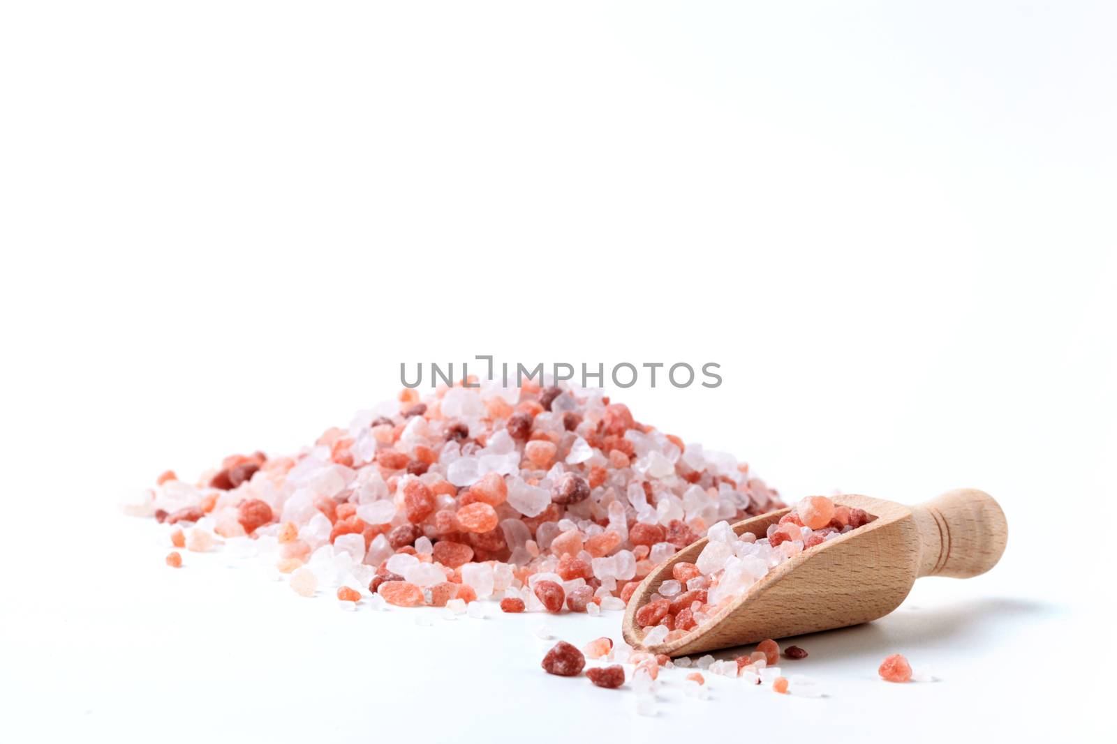 Himalaya Salt Pile with Wood Spoon Isolated On White Background