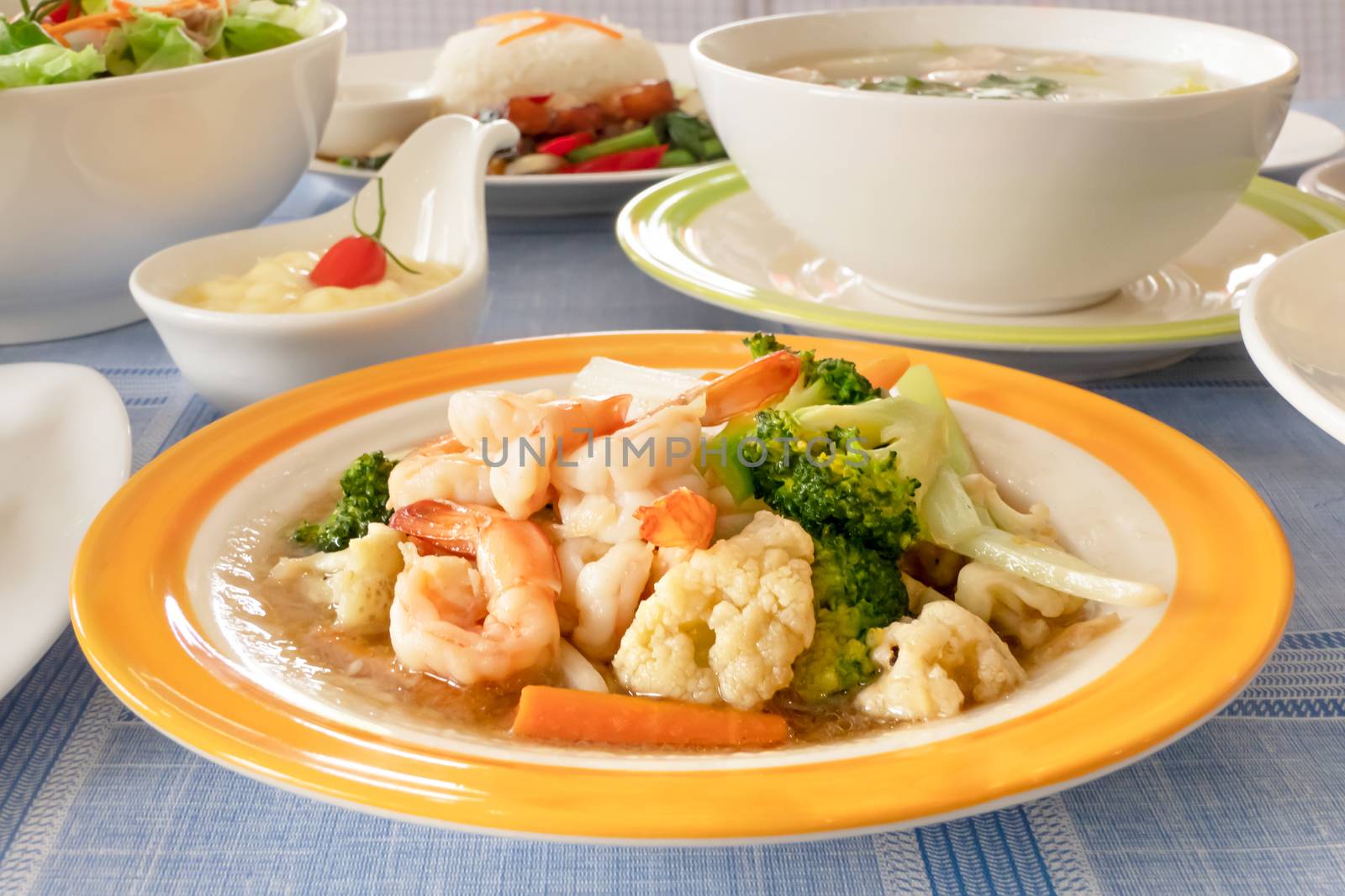 Stir fried shrimp with mix vegetable on dish , asian style food