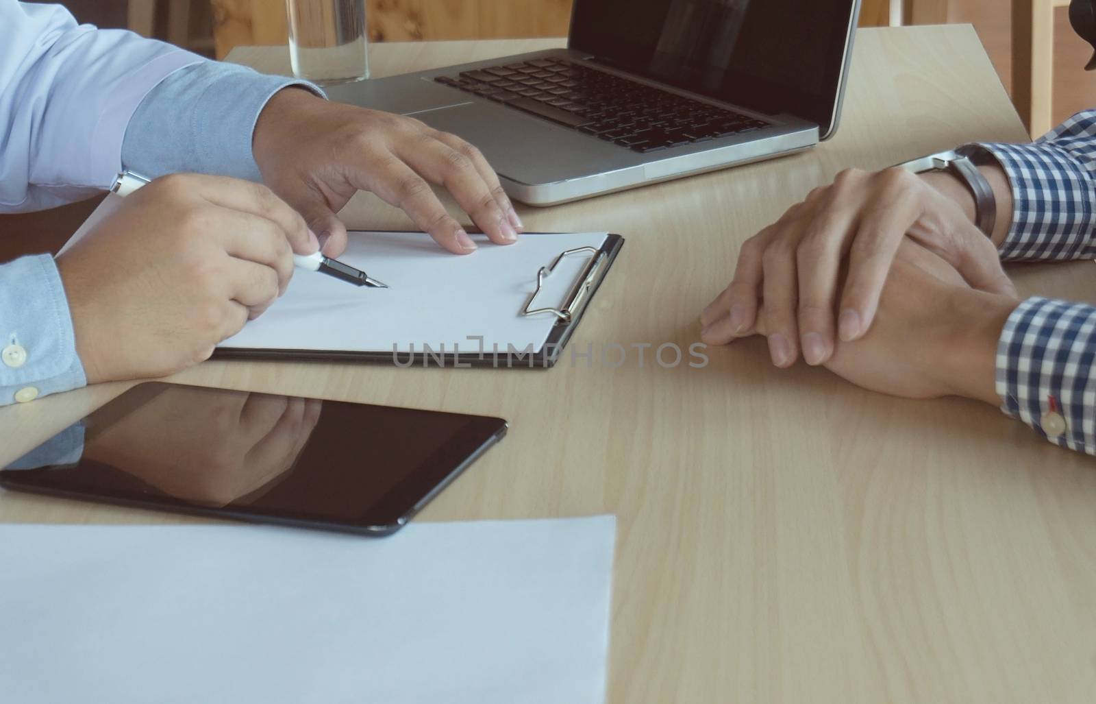 close up of patient and doctor taking notes or Professional medical doctor in white uniform gown coat interview.