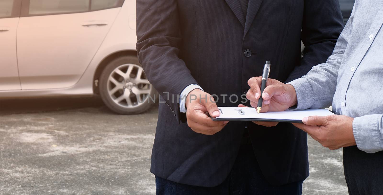 Loss Adjuster Insurance Agent Inspecting Damaged Car. by peandben