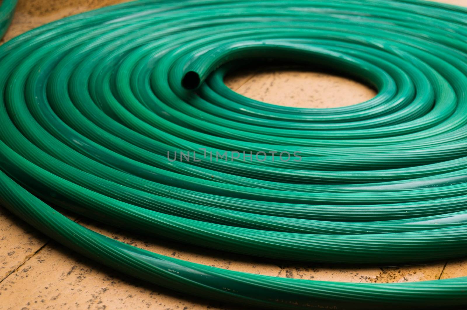 Abstract of Green Rubber tube Texture for watering plants in the garden.