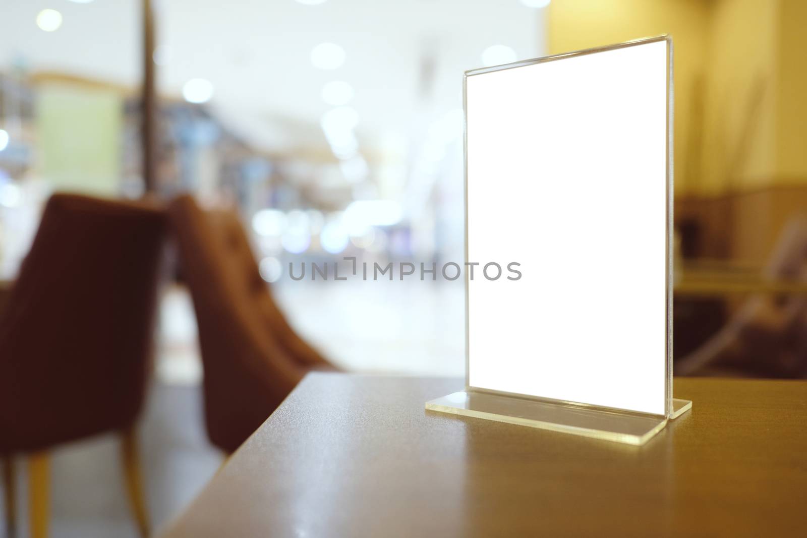 Mock up Menu frame standing on wood table in Bar restaurant cafe by peandben