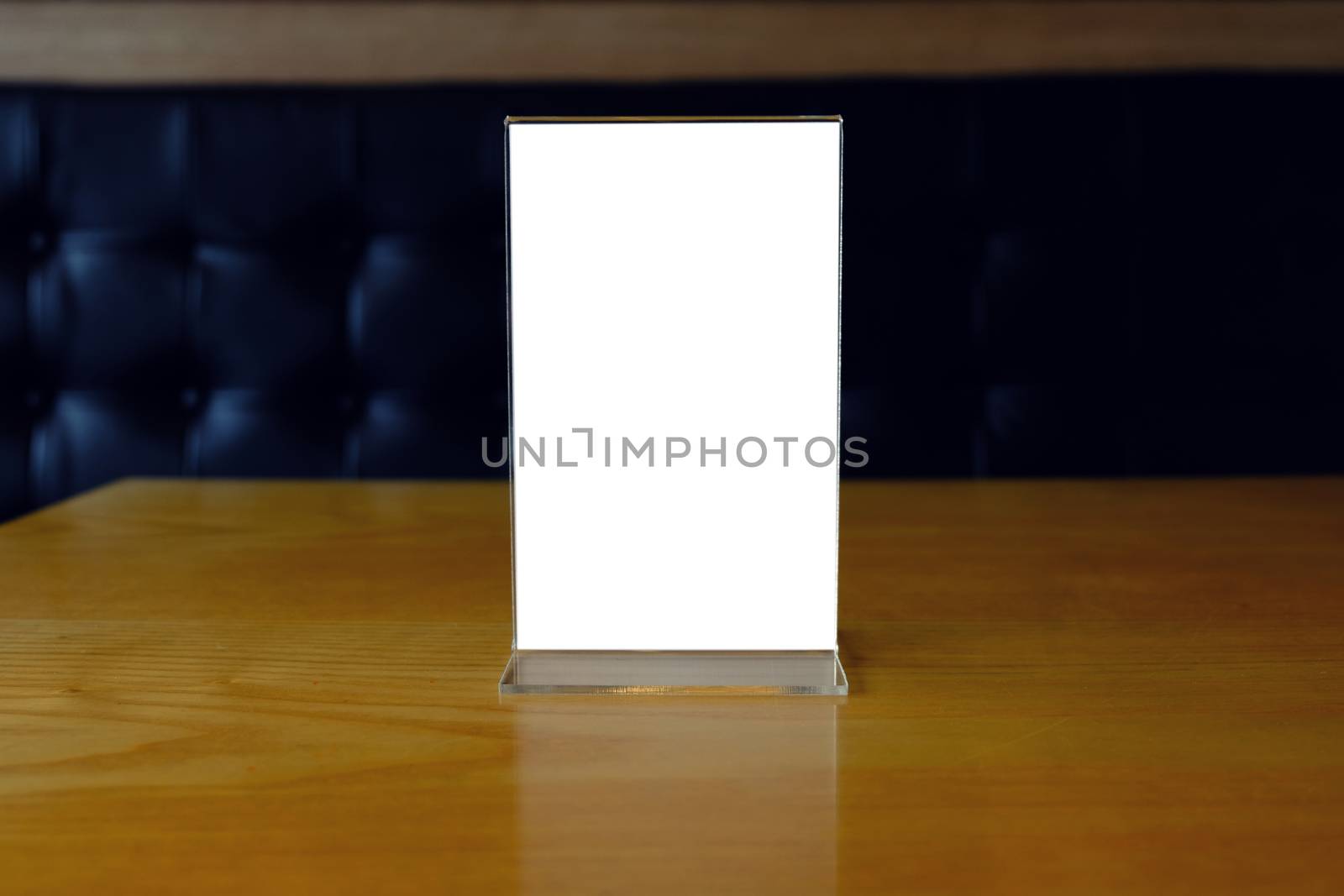 Mock up Menu frame standing on wood table in Bar restaurant cafe by peandben