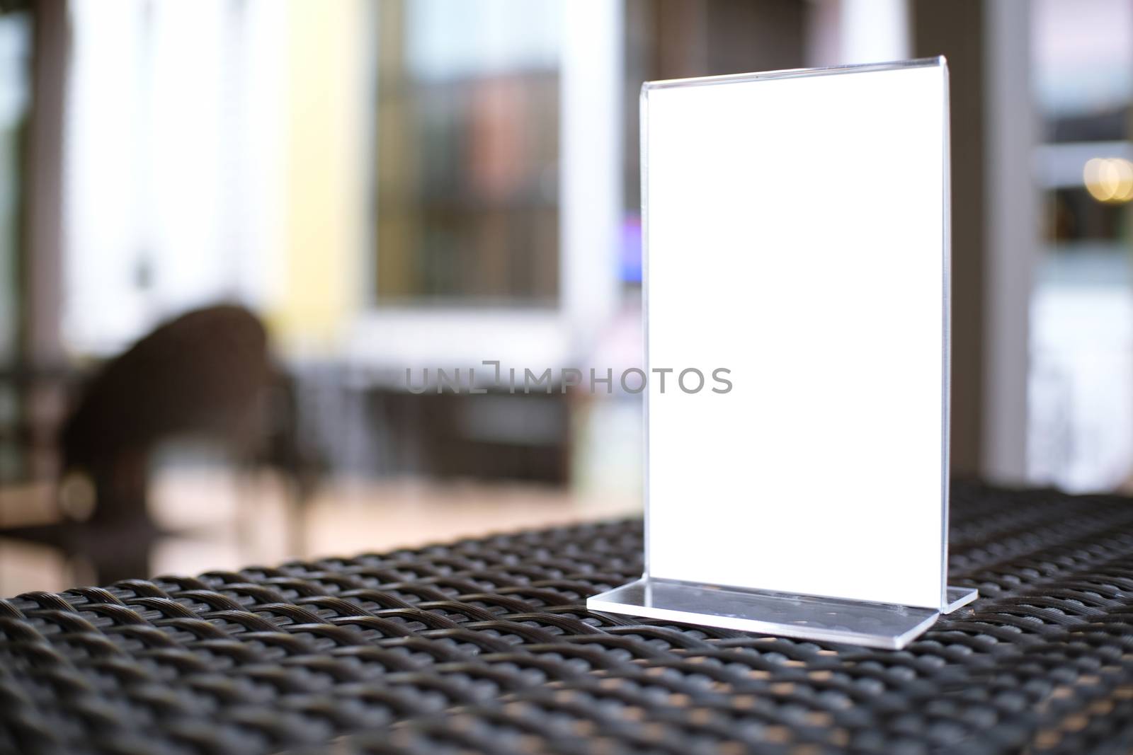 Mock up Menu frame standing on wood table in Bar restaurant cafe by peandben