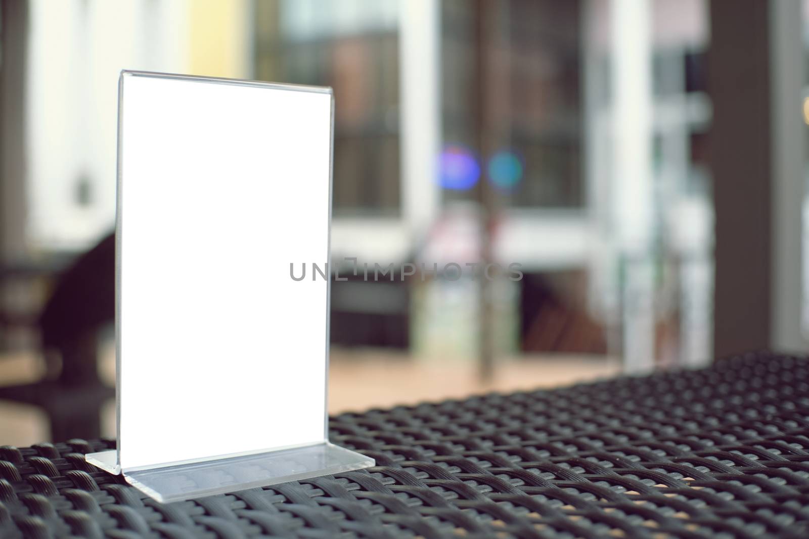 Mock up Menu frame standing on wood table in Bar restaurant cafe by peandben