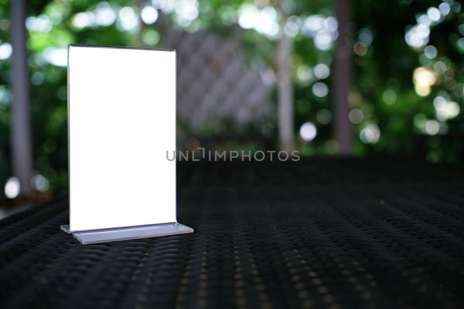 Mock up Menu frame standing on wood table in Bar restaurant cafe by peandben