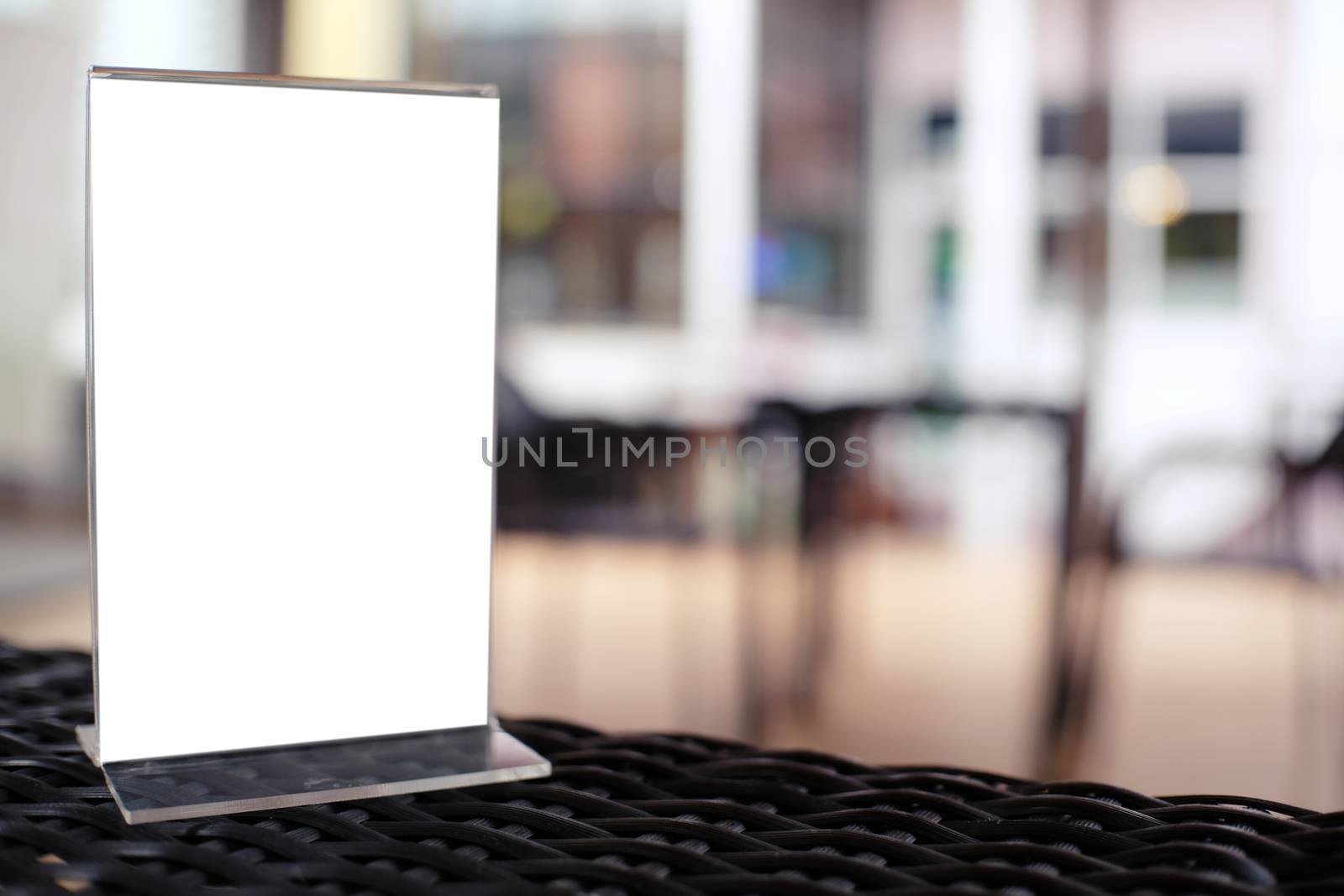 Mock up Menu frame standing on wood table in Bar restaurant cafe by peandben