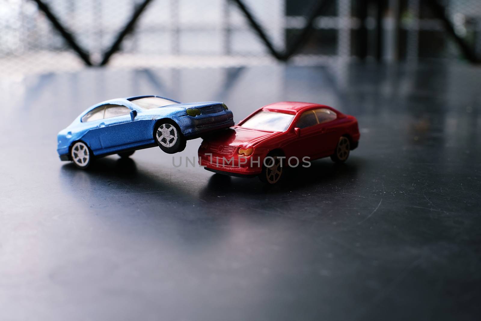 Toy cars crash accident. Simulation  red and  blue car.