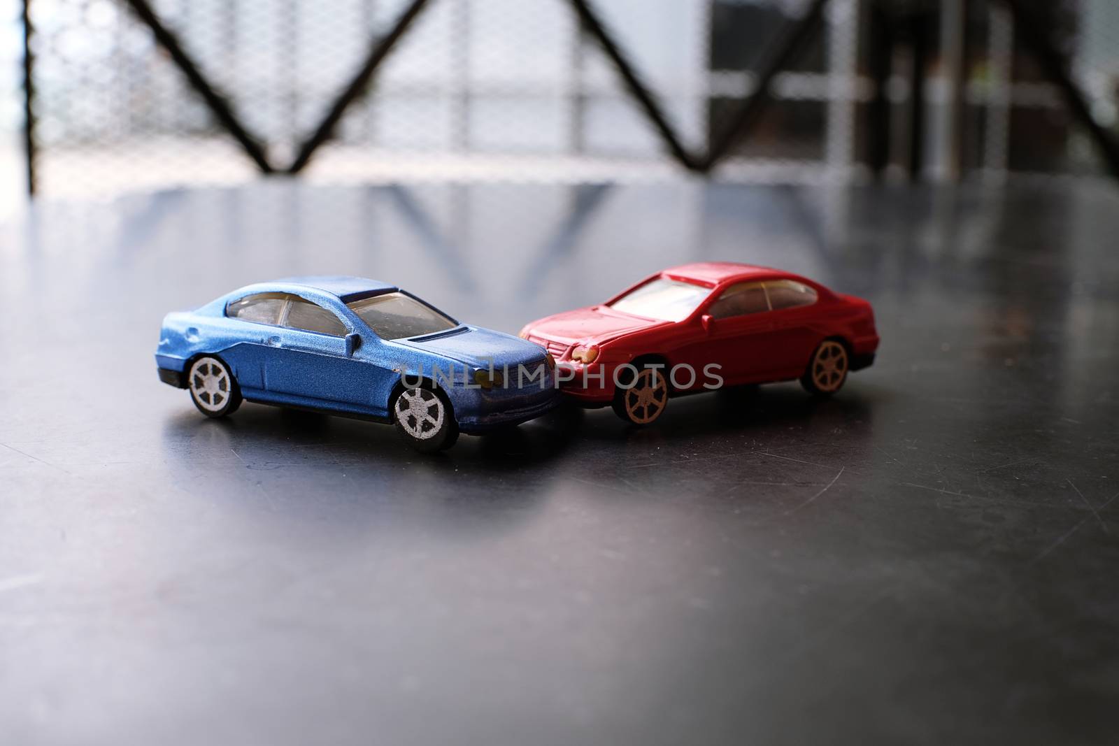 Toy cars crash accident. Simulation  red and  blue car by peandben