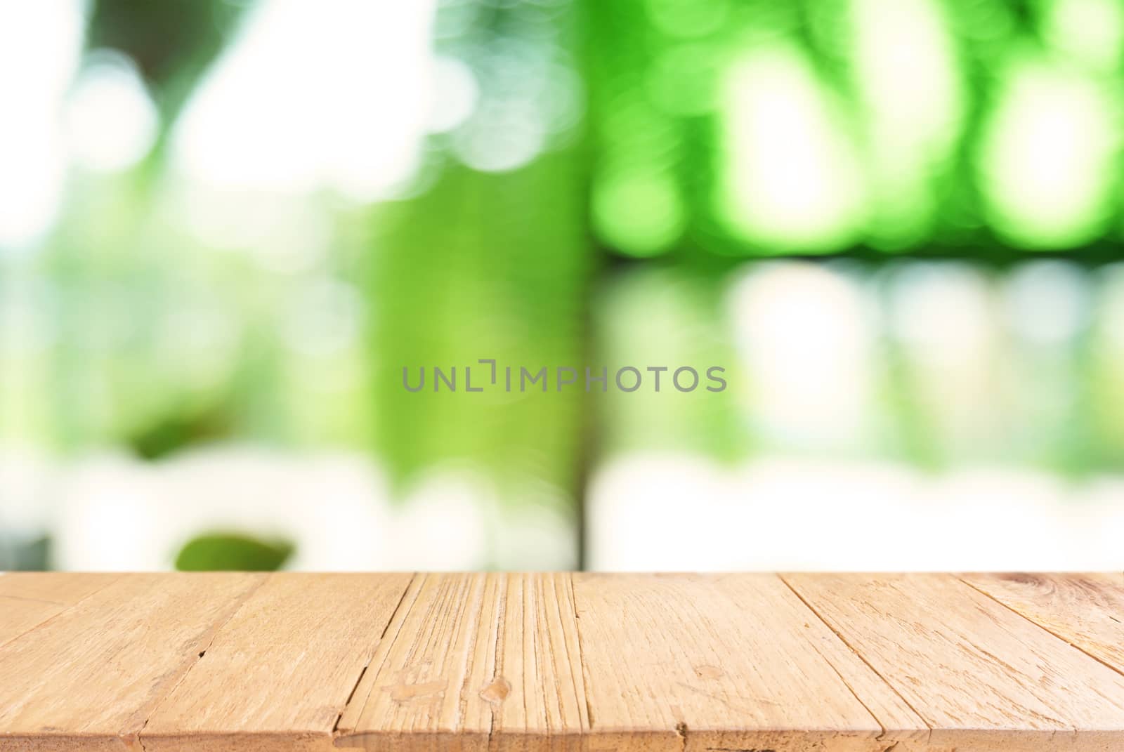 Empty dark wooden table in front of abstract blurred background  by peandben