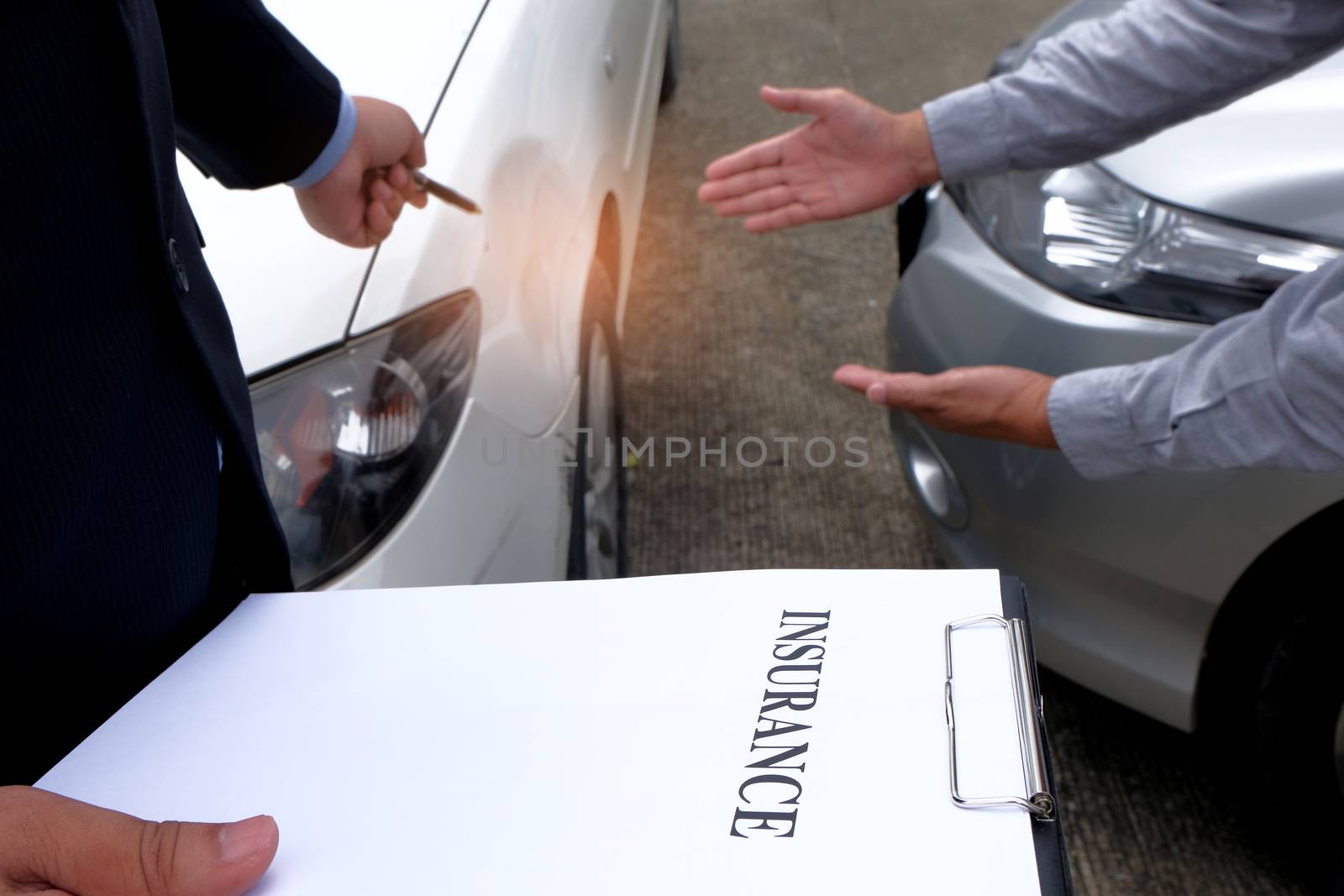 Loss Adjuster Insurance Agent Inspecting Damaged Car 