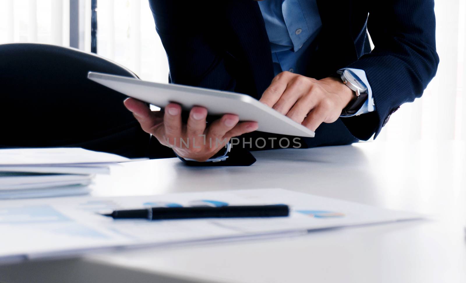 Business people making presentation with his colleagues and business tablet digital computer as meeting concept