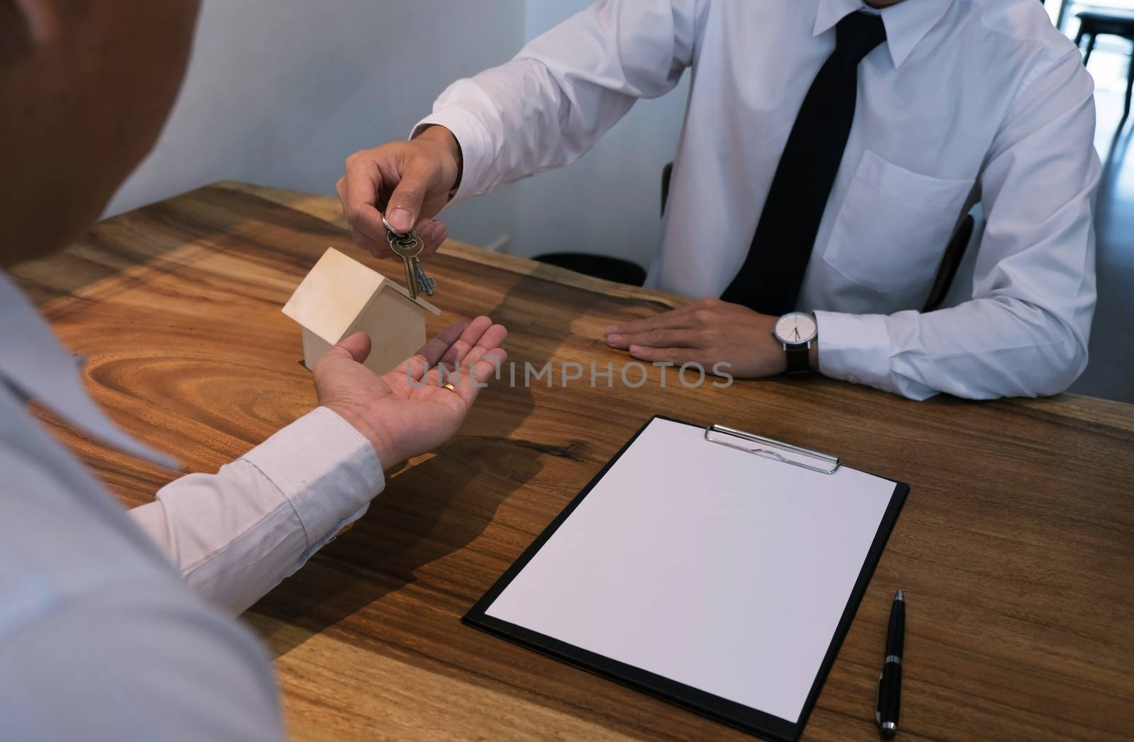 business man signing contract making a deal with real estate agent Concept for consultant