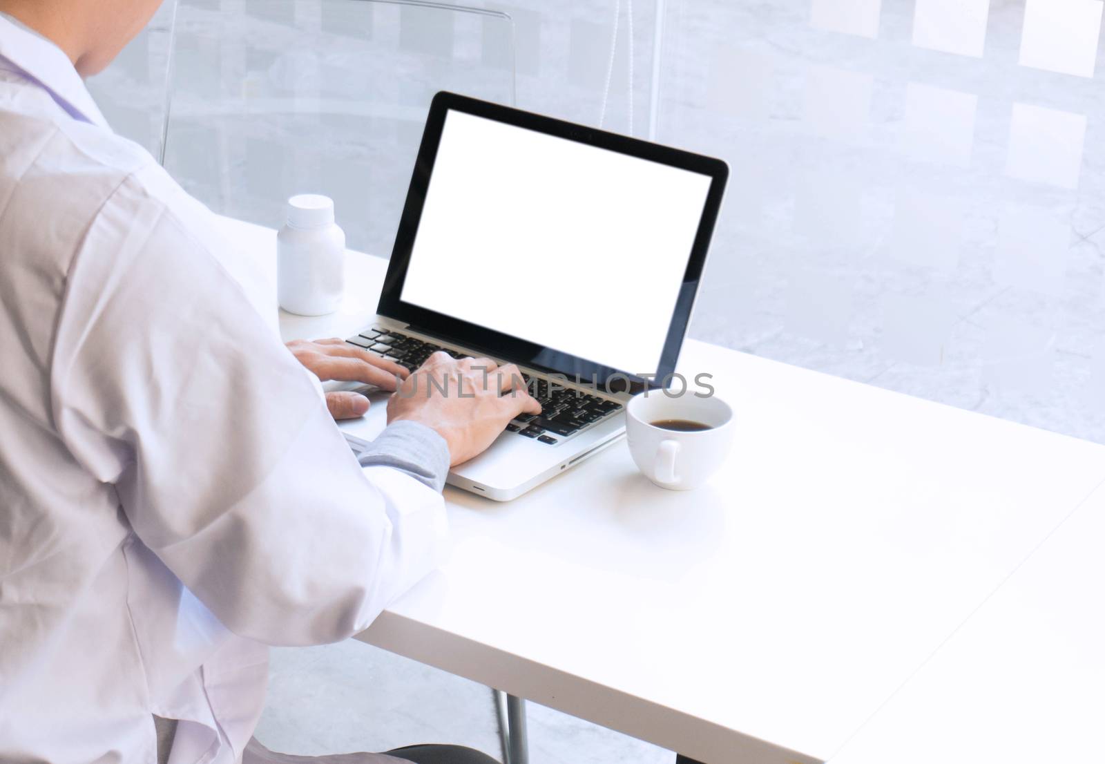 View of Details of doctor hands typing on keyboard with blank screen