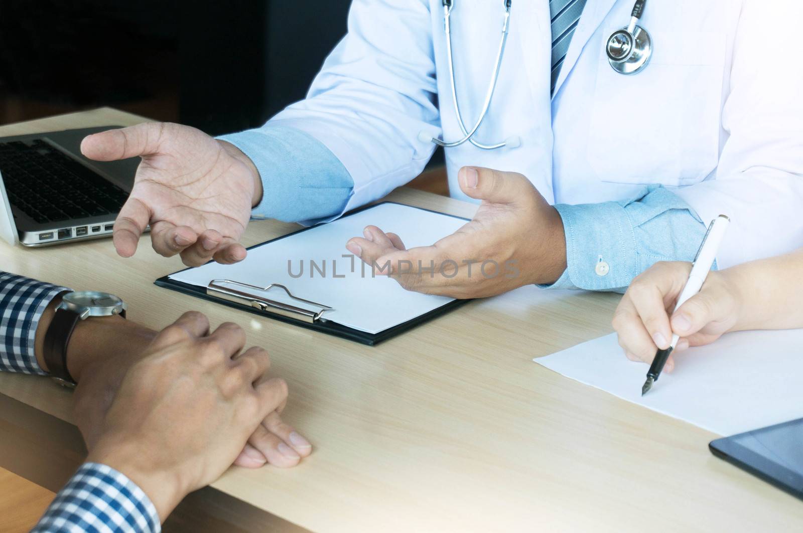 close up of patient and doctor writing something on clipboard Ward round, patient visit check, Medicine and health care concept. Physician ready to examine patient.