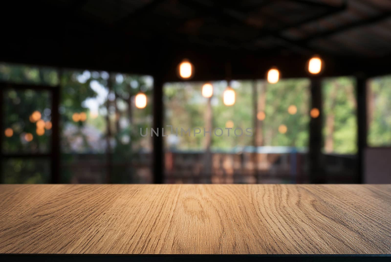 Empty wood table top and blur of night market background/selective focus .For montage product display