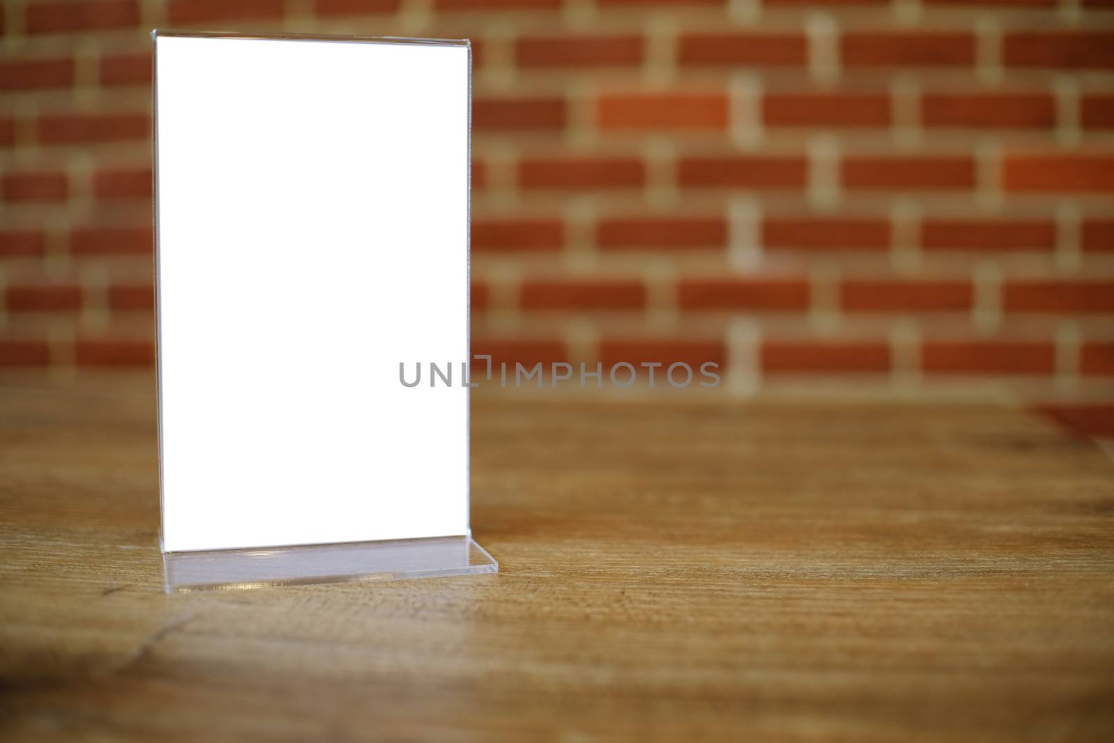 Mock up Menu frame standing on wood table in Bar restaurant cafe by peandben