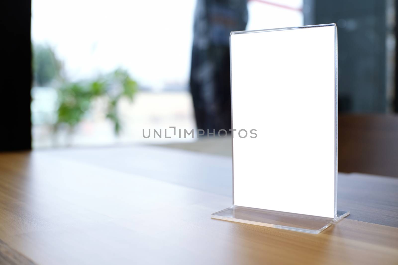 Mock up Menu frame standing on wood table in Bar restaurant cafe by peandben