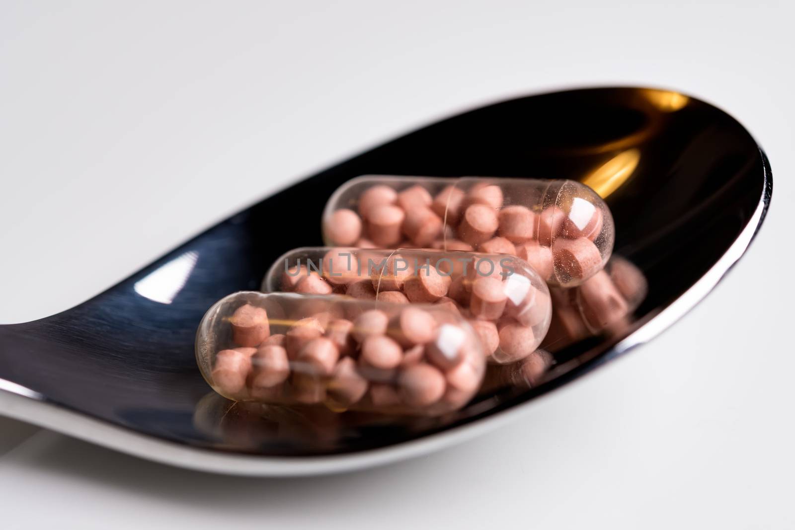 Tablets on a spoon by w20er