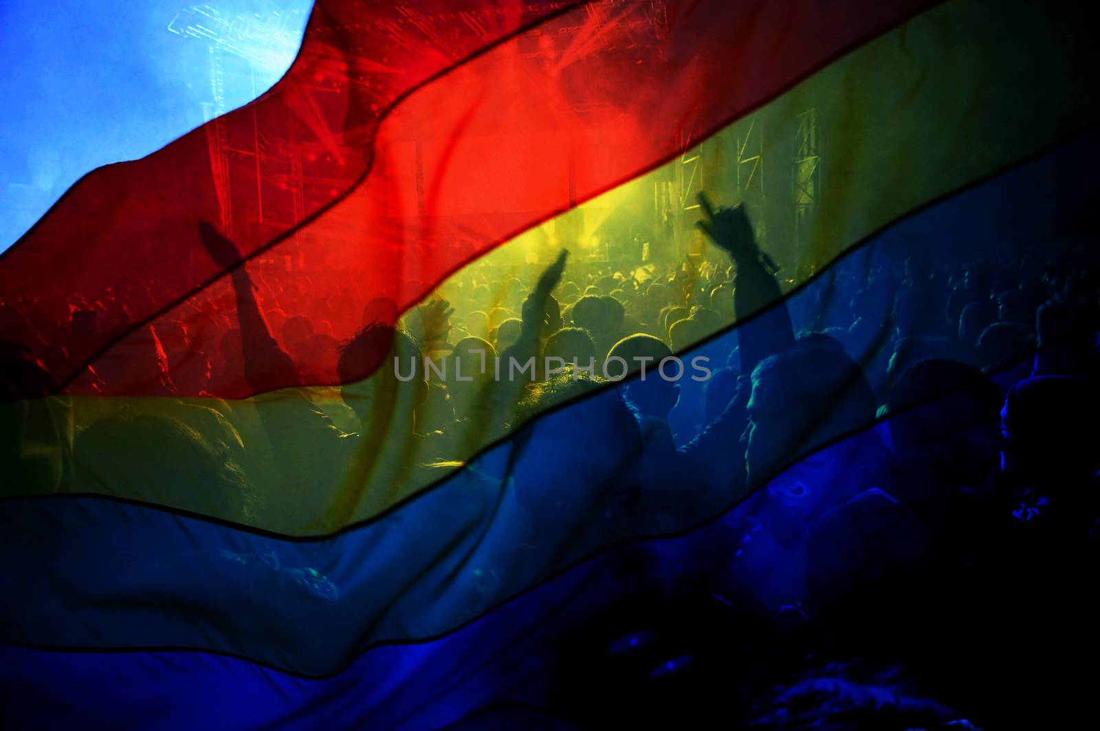 silhouette of a parade of gays and lesbians with a rainbow flag - symbol of love and tolerance