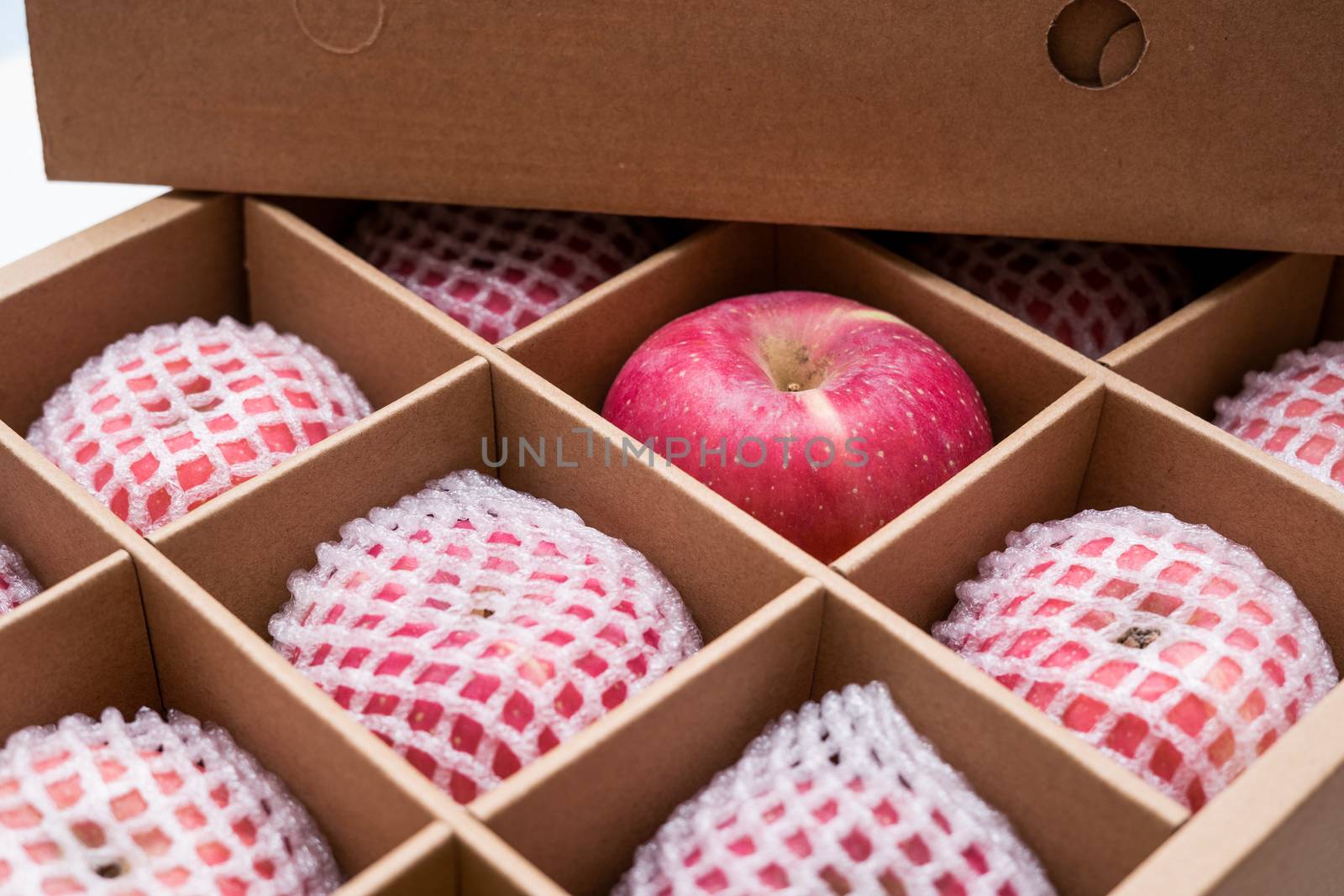 red apples in paper box by antpkr