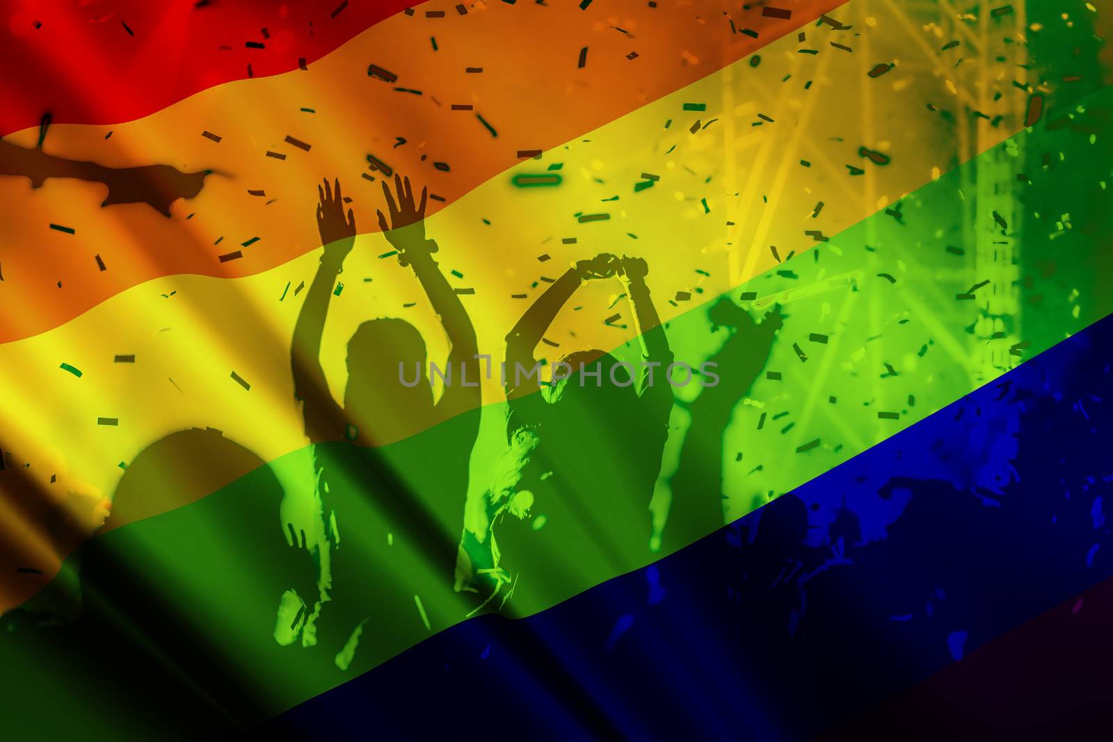 silhouette of a parade of gays and lesbians with a rainbow flag - symbol of love and tolerance