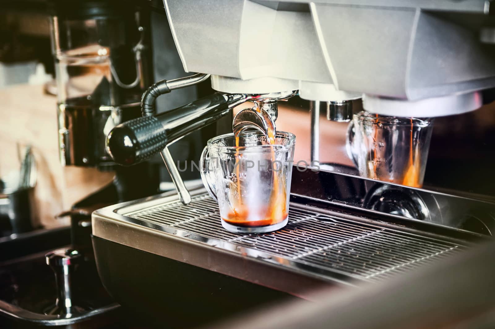 closeup of coffee machine making espresso process by sayhmog
