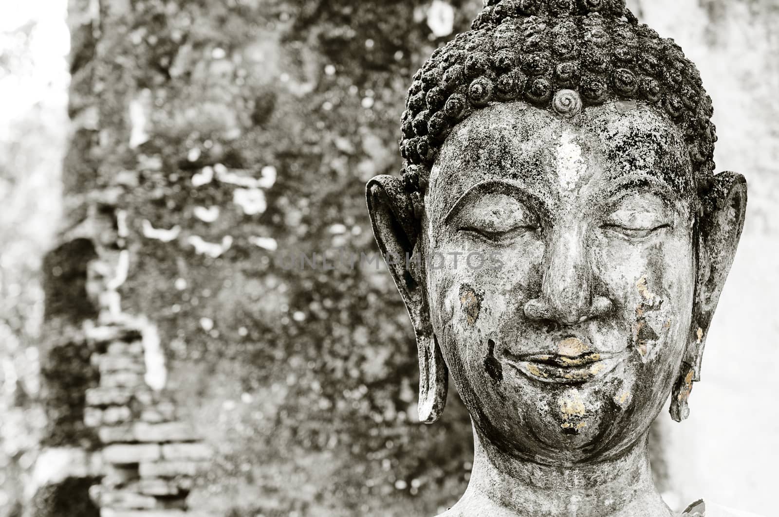 Closeup of old Buddha sculpture.