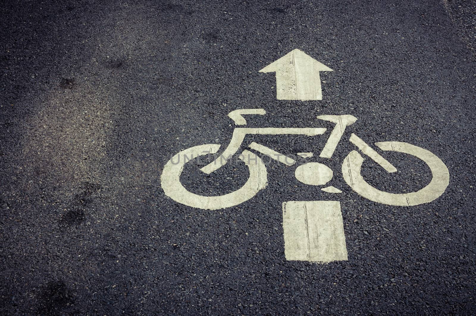 bicycle lane sign on the road