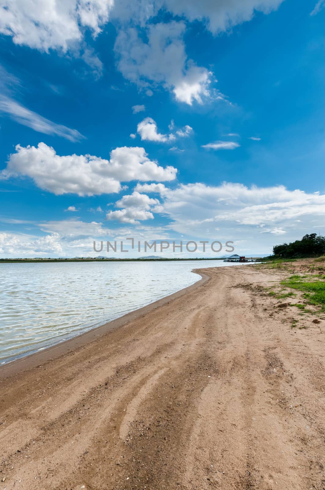 blue sky with clouds sky with marsh beach landscape